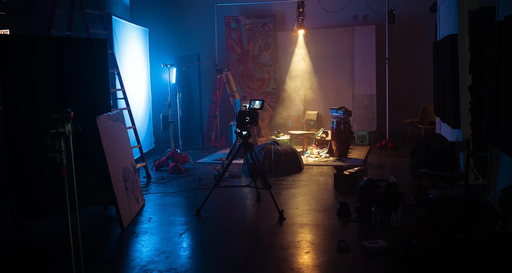 Creative production studio with camera and dramatic lighting