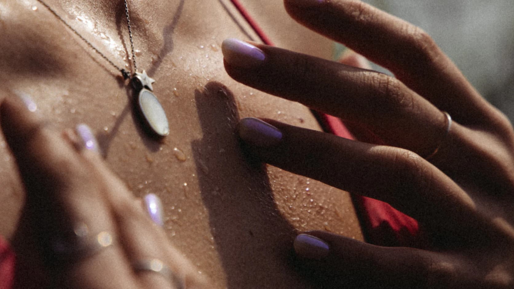 Manicured lavender nails in moody light
